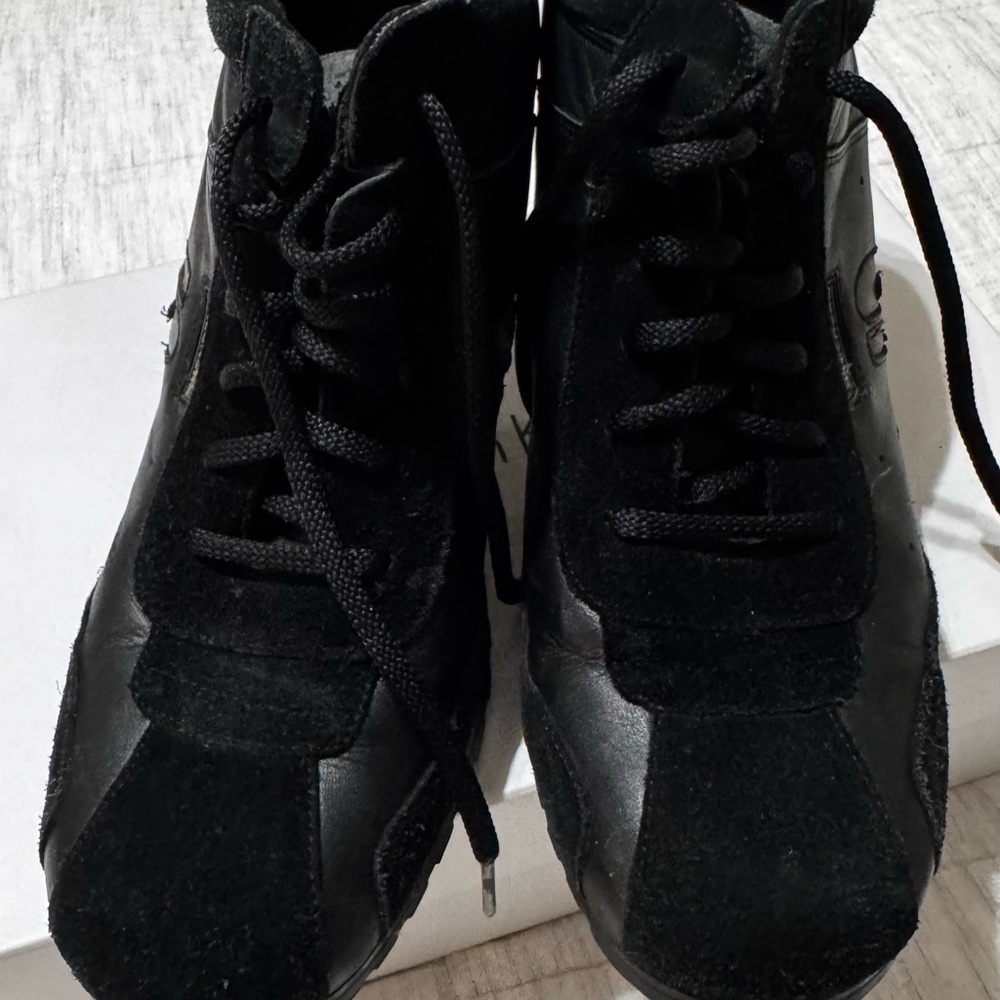 Women high heel sneaker style show .